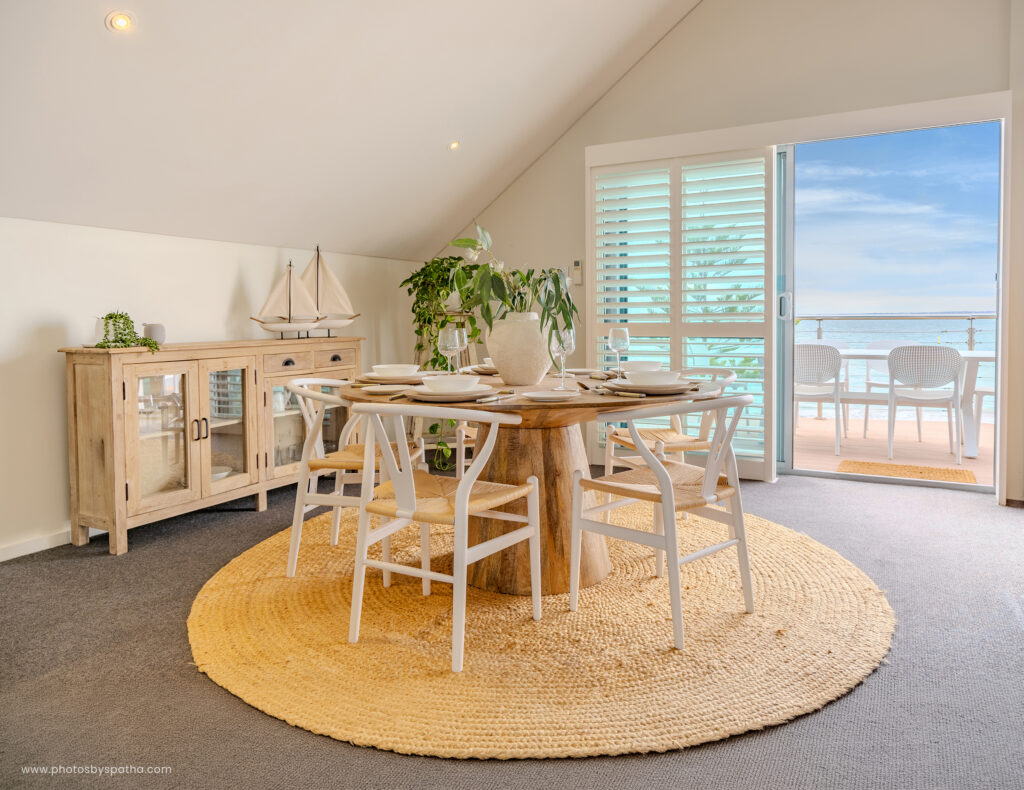 Airbnb photography Perth - rooftop dining setup overlooking the ocean, Mandurah