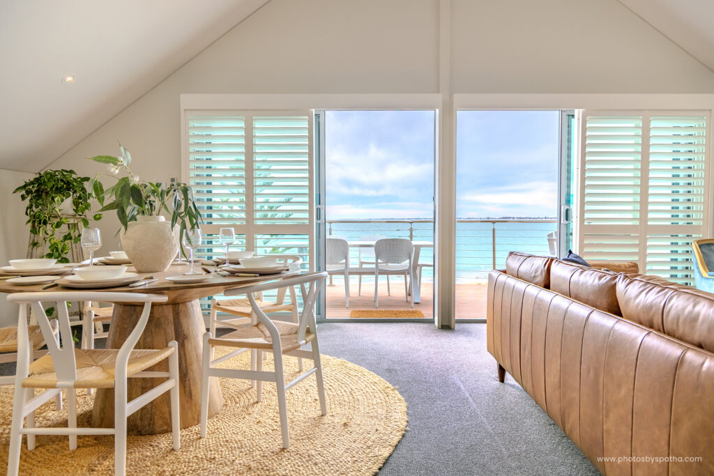 Ocean-view living room with natural light at Sea Breeze Villa Airbnb, Mandurah